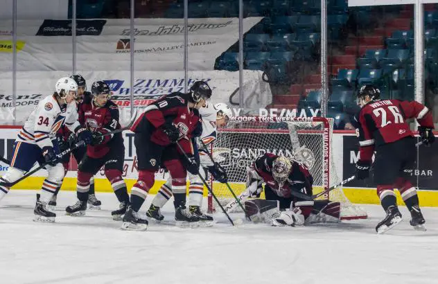 Vancouver Giants goaltender Trent Miner smothers the puck vs. the Kamloops Blazers