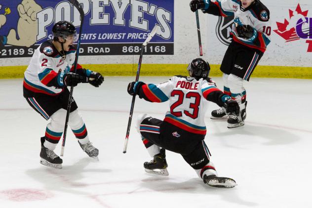 Jake Poole of the Kelowna Rockets celebrates with teammates following a goal