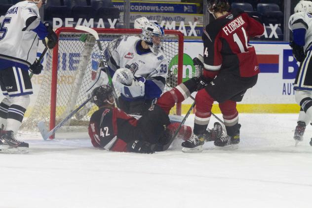 Vancouver Giants centre Justin Sourdif and forward Eric Florchuk (right) vs. the Victoria Royals