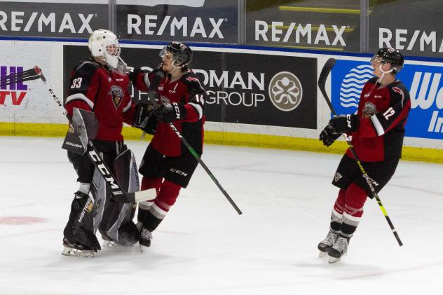 Vancouver Giants centre Eric Florchuk congratulates goaltender Drew Sim vs. the Victoria Royals