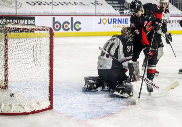 Blake Eastman of the Prince George Cougars provides a screen vs. the Vancouver Giants