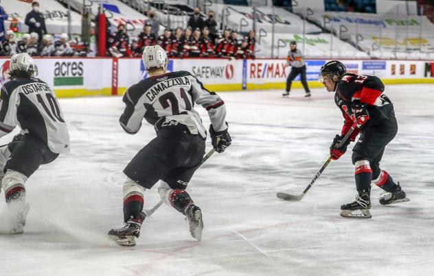 Koehn Ziemmer of the Prince George Cougars (right) vs. the Vancouver Giants