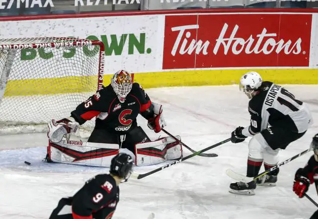 Prince George Cougars goaltender Taylor Gauthier makes a stop in close vs. the Vancouver Giants