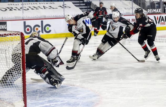 Vancouver Giants defenceman Connor Horning (center) vs. the Prince George Cougars