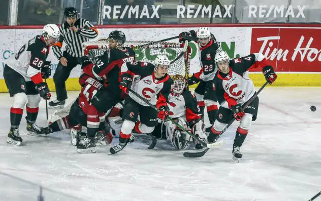 Prince George Cougars clear the puck after a scrum in front of their net vs. the Vancouver Giants