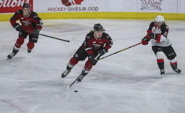 Vancouver Giants right wing Justin Lies with the puck vs. the Prince George Cougars