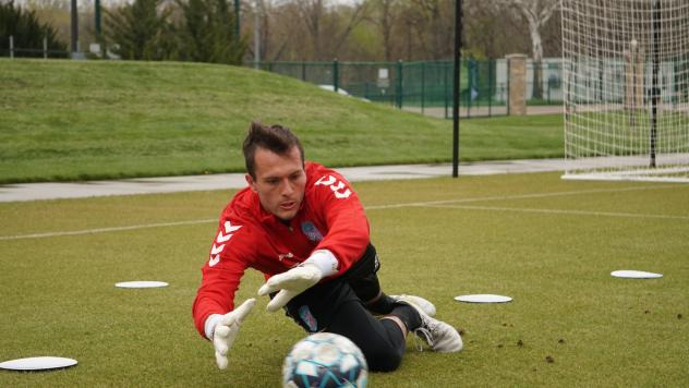 Forward Madison FC goalkeeper Aidan Hogan