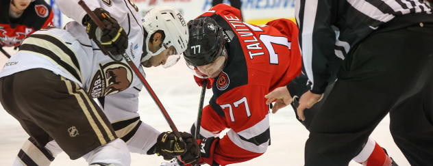 Binghamton Devils forward Aarne Talvitie faces off with the Hershey Bears