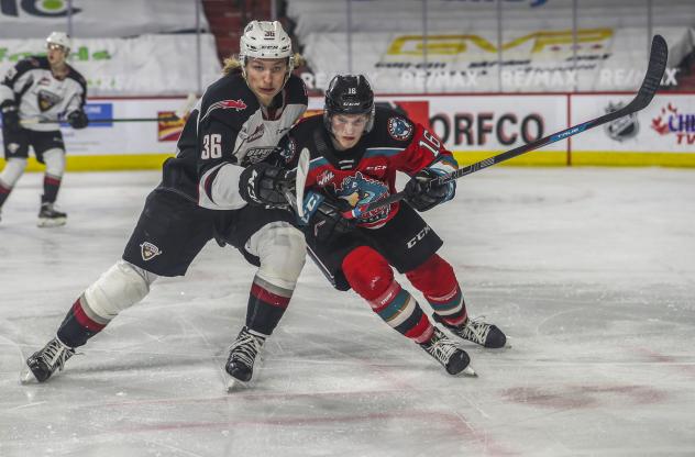 Vancouver Giants right wing Justin Lies (left) vs. the Kelowna Rockets