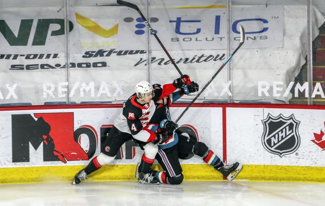 Prince George Cougars defenseman Ethan Samson flattens a Kelowna Rocket