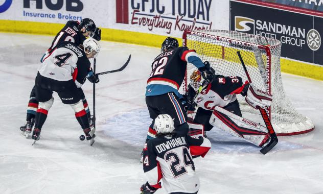 Prince George Cougars defend against the Kelowna Rockets
