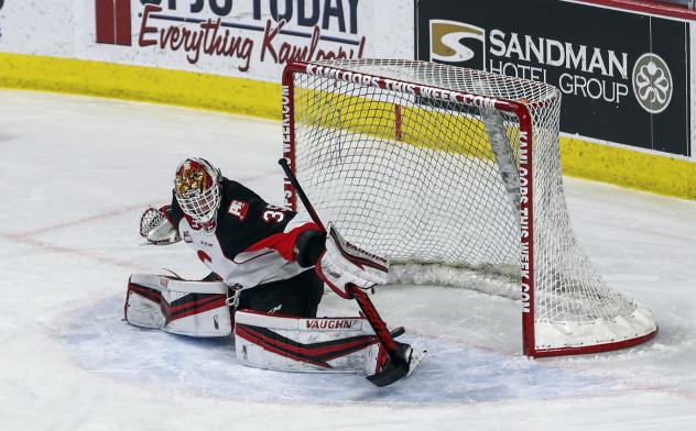 Prince George Cougars goaltender Taylor Gauthier makes a save vs. the Kelowna Rockets