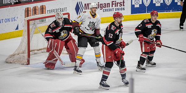 Grand Rapids Griffins goaltender Calvin Pickard and his defense against the Chicago Wolves