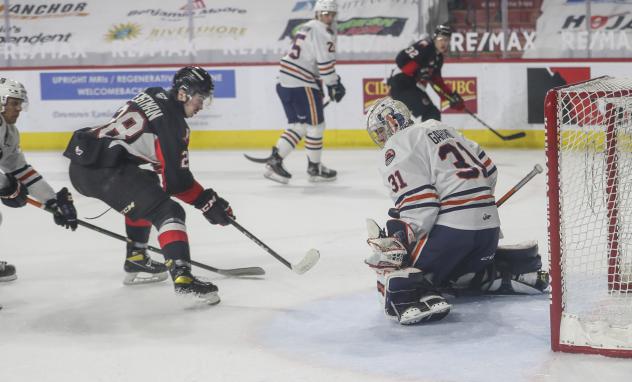 Prince George Cougars right wing Blake Eastman just misses a shot against the Kamloops Blazers