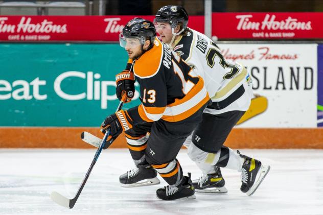 Wheeling Nailers forward Tim Doherty (right) vs. the Fort Wayne Komets