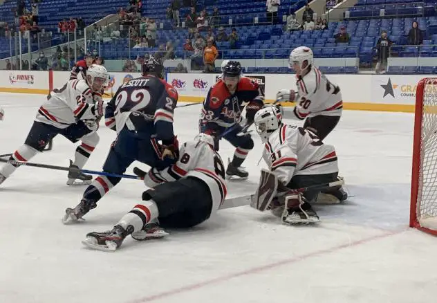 Odessa Jackalopes and Amarillo Bulls scramble in front of the Odessa net