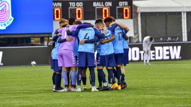 Forward Madison FC huddles up against North Carolina FC