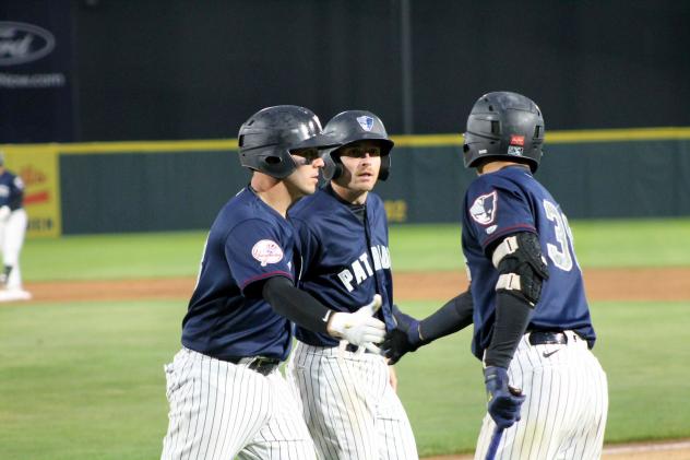 Somerset Patriots exchange high fives after a run