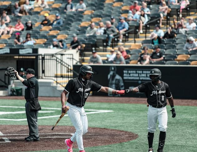 Milwaukee Milkmen exchange fist bumps