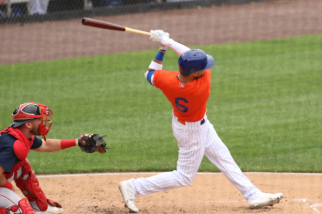 Albert Almora, Jr. finishes his swing on a ball he hit for a two-run home run for the Syracuse Mets on Wednesday afternoon