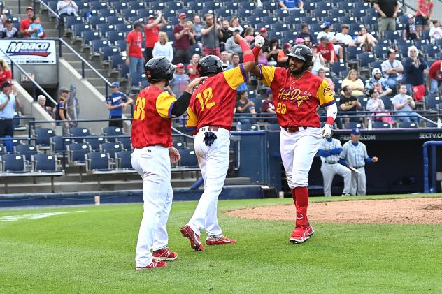 Reading Hot Dogs (Fightin Phils) outfielder Jorge Bonifacio receives congratulations after his homer