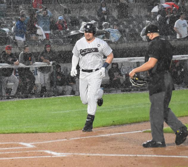 Luke Voit reaches home after a homer in the rain