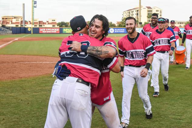 J.D. Osborne of the Pensacola Blue Wahoos is congratulated after a walk-off win