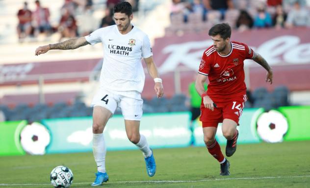 Phoenix Rising FC midfielder Aodhan Quinn (right) vs. Sacramento Republic