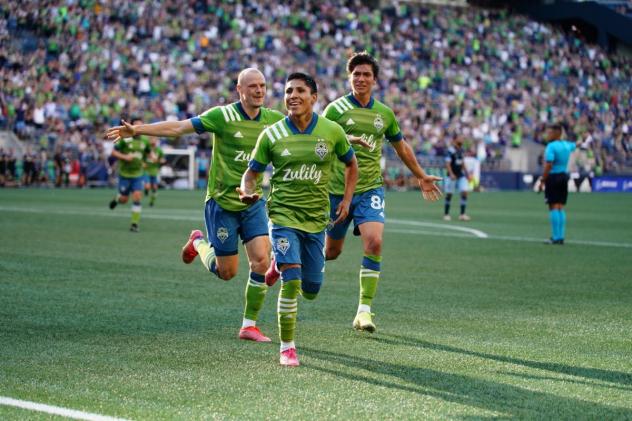 Seattle Sounders FC celebrate a goal against the Vancouver Whitecaps