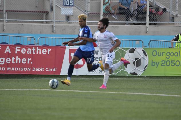 Forward Madison FC forward Derek Gebhard (left) vs. New England Revolution II