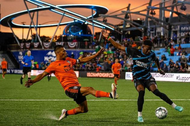 Colorado Springs Switchbacks FC midfielder Michee Ngalina (right) vs. Orange County SC