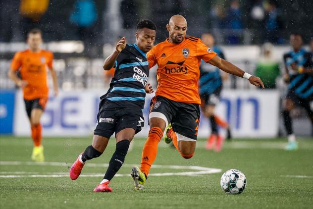 Colorado Springs Switchbacks FC forward Austin Dewing (left) vs. Orange County SC
