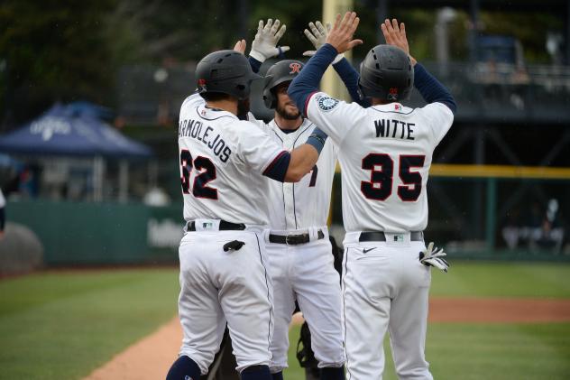 The Tacoma Rainiers celebrate at home following a home run