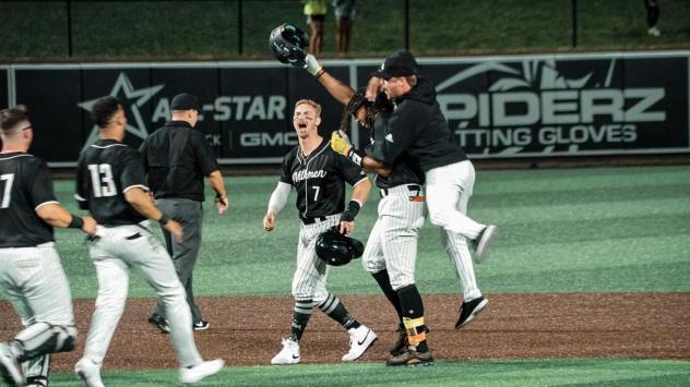 Milwaukee Milkmen celebrate an extra-innings win