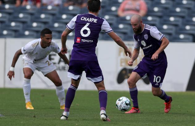 Louisville City FC midfielder Brian Ownby (right) and defender Wes Charpie vs. FC Tulsa