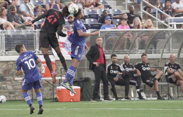 Phoenix Rising FC midfielder James Musa (41) goes high against the Charlotte Independence