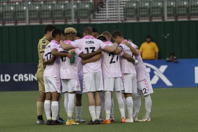Forward Madison FC huddles vs. North Texas SC