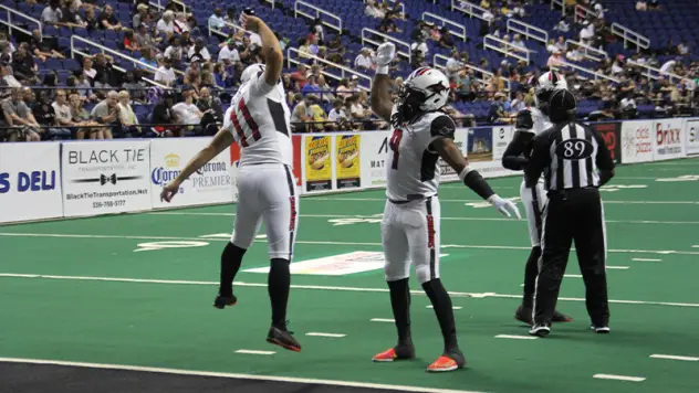 Jacksonville Sharks kicker Brandon Behr and receiver Jarmon Fortson