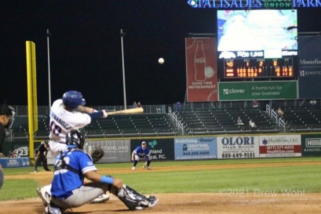 New York Boulders' Ray Hernandez connects for his 12th home run of the season against Equipe Quebec