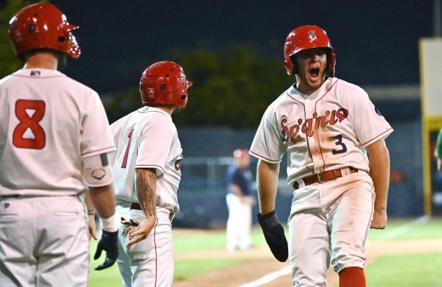 Spokane Indians infielder Kyle Datres reacts as he comes in to score