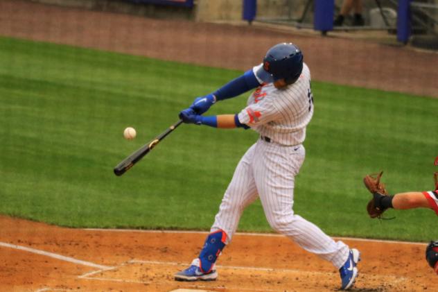 The Syracuse Mets' Chance Sisco connects with a ball that he hit for a three-run home run in the first inning on Friday night
