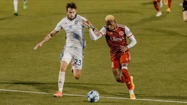 South Georgia Tormenta FC defender Curtis Thorn (left) vs. the Richmond Kickers