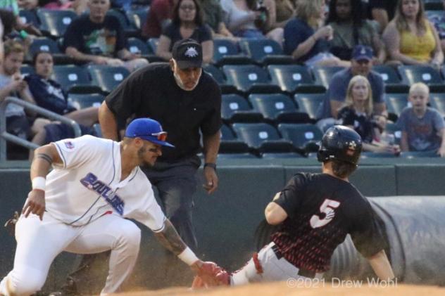 New York Boulders 3B Ray Hernandez slaps a tag on a sliding Nick Ward to get the Wild Things' baserunner on an attempted steal of third base