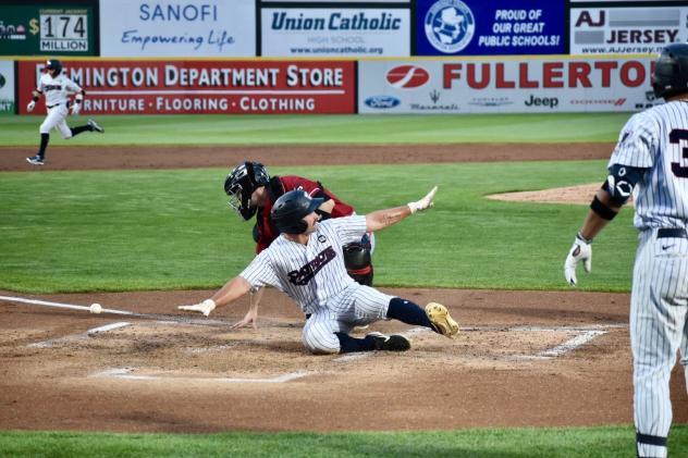 Aaron Palensky of the Somerset Patriots slides home