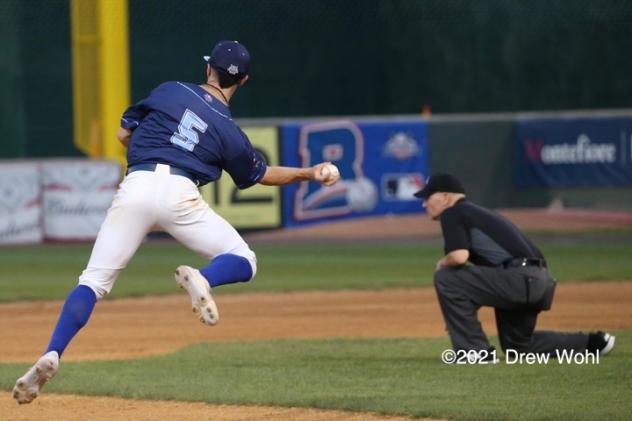 New York Boulders shortstop Phil Caulfield makes an off-balance throw to complete a second inning force play