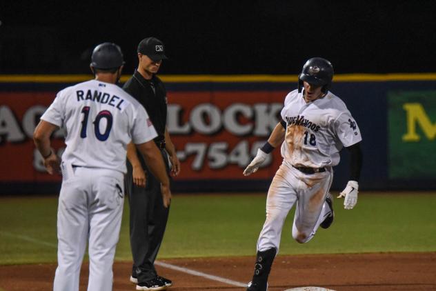 Griffin Conine of the Pensacola Blue Wahoos rounds the bases following his home run
