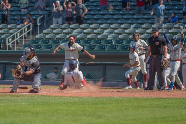 Kevin Santa scores the winning run for the Kansas City Monarchs against the Milwaukee Milkmen