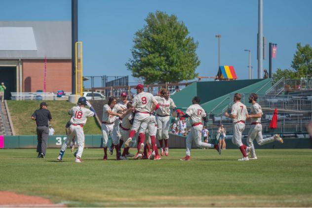 Morgan McCullough is mobbed by his Kansas City Monarchs teammates after the walk off winner against the Milwaukee Milkmen