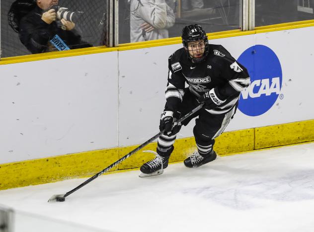 Defenseman Spenser Young with Providence College