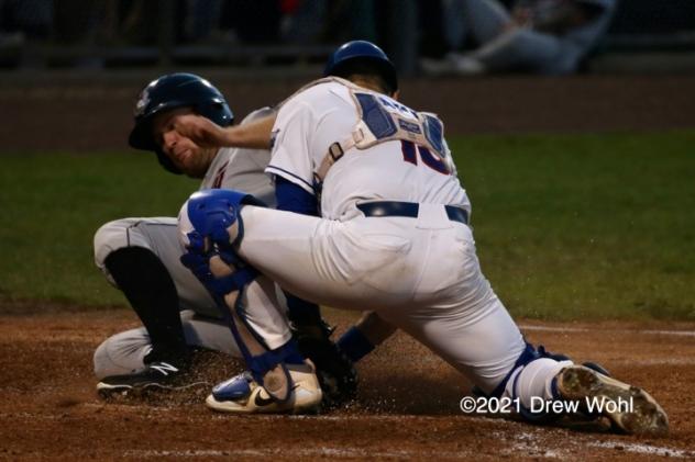 Tri-City's Zach Biermann slides safely into home plate under tag of New York Bouders' Phil Capra in third inning